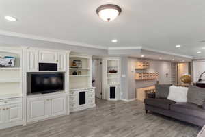 Recreation room with built-in cabinets and audio surround sound