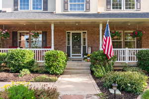 Entrance to property with a porch