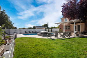 View of yard featuring a fenced in pool and a patio area