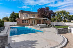 Saltwater pool featuring a patio area