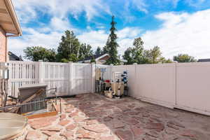 View of patio with pool equipment and generator