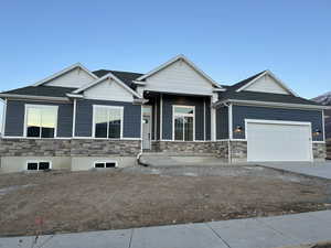 Craftsman house with a garage