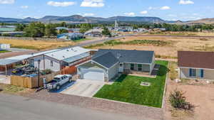 Birds eye view of property featuring a mountain view