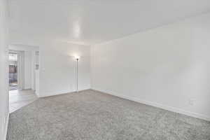 Unfurnished room featuring carpet floors