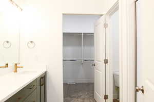 Bathroom featuring vanity and toilet