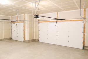 Garage featuring a garage door opener