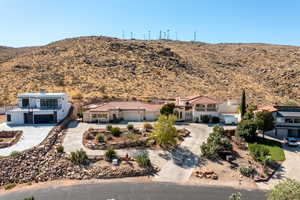 View of front of house featuring a mountain view and a garage