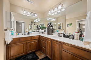 Bathroom with vanity and a textured ceiling