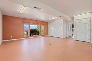 Unfurnished room featuring a textured ceiling