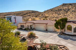 Mediterranean / spanish home with a mountain view and a garage