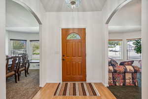 Foyer featuring a chandelier and hardwood / wood-style flooring