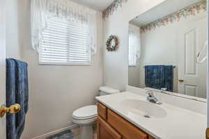 Bathroom featuring vanity and toilet