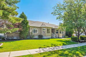 View of front of property with a front yard