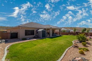 Fully fenced back yard with 2 side gates