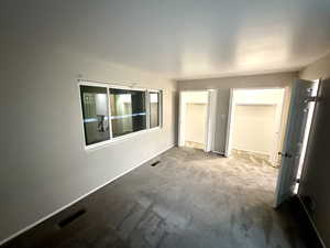 Night View of Lighted Double Closets in Second Bedroom