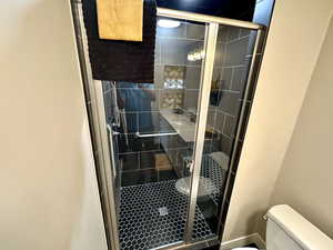 Master Bathroom Includes a Beautiful All Tiled Shower with Nice Sitting Area and