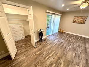 Master Bedroom Walk In Closet Featuring Chest of Drawers and Closet Organizers