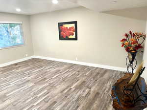 Spacious Living Room with Bright Windows Including Blinds