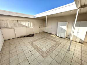 Patio Back Entrance and Storage Closet next to Trash Receptacle Enclosure