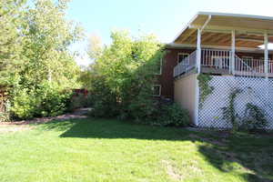 View of backyard with a covered deck