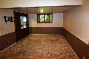 Family room with carpet and a fireplace