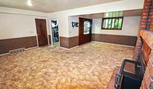 Family room with carpet and a fireplace