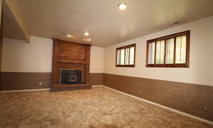 Family room with carpet and a fireplace