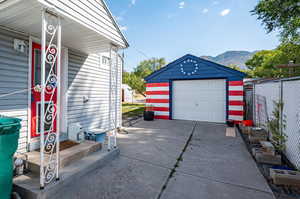 Side entrance into kitchen and Garage featuring a mountain view