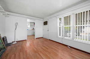 Living room featuring light hardwood / wood-style flooring and plenty of natural light