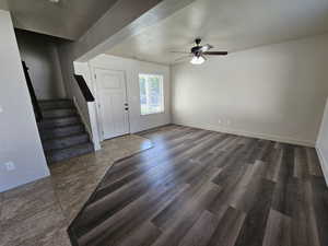 Entryway featuring ceiling fan, hardwood / wood-style flooring, and a textured ceiling