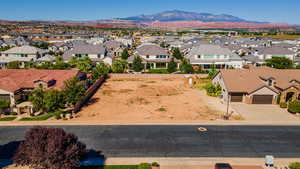 Birds eye view of property with a mountain view