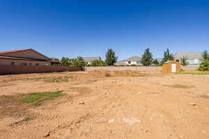 View of yard with a storage shed