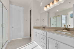 Bathroom with vanity and an enclosed shower