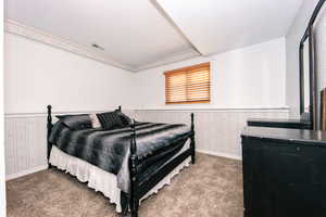 Carpeted bedroom with a textured ceiling