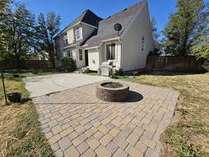 View of patio area, and a fire pit