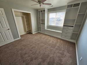 bedroom with ceiling fan, a closet, light carpet, and a textured ceiling