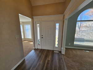 Entryway with new florring and vaulted ceiling