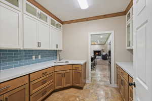 Butler's Pantry directly off the kitchen, beautiful kitchen design carried into the pantry