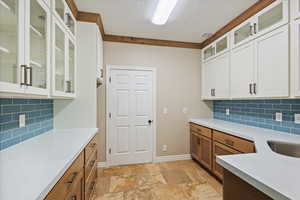 Butler's Pantry equipped with washer/dryer hookups and sink