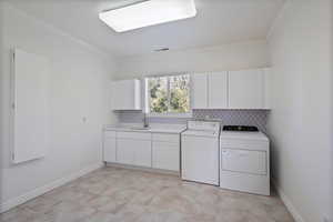 Upper level large laundry room with quartz counter and sink