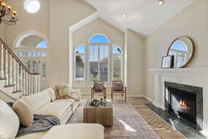 Main level formal living room with picturesque windows offering ample natural light