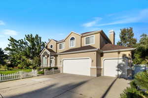 Three car garage with storage or workbench space