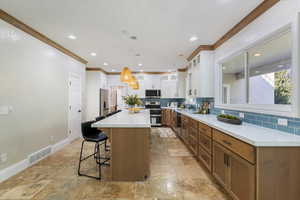 No shortage of counter and storage space in this lovely kitchen