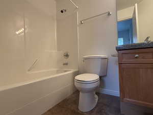 Full bathroom with tile patterned floors, vanity, toilet, and shower / bathtub combination