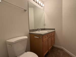 Bathroom with vanity and toilet