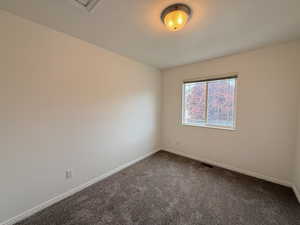 Empty room featuring carpet