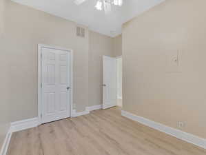 Bedroom with ceiling fan and light hardwood / wood-style flooring