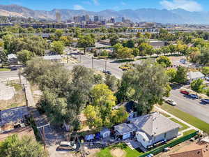 Drone / aerial view featuring mountain and city views.