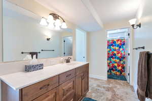 Bathroom with walk in shower and vanity