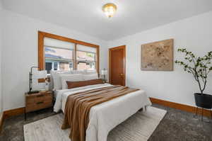 Primary bedroom with large windows and closet.